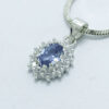 Dije colgante de plata con topacio azul